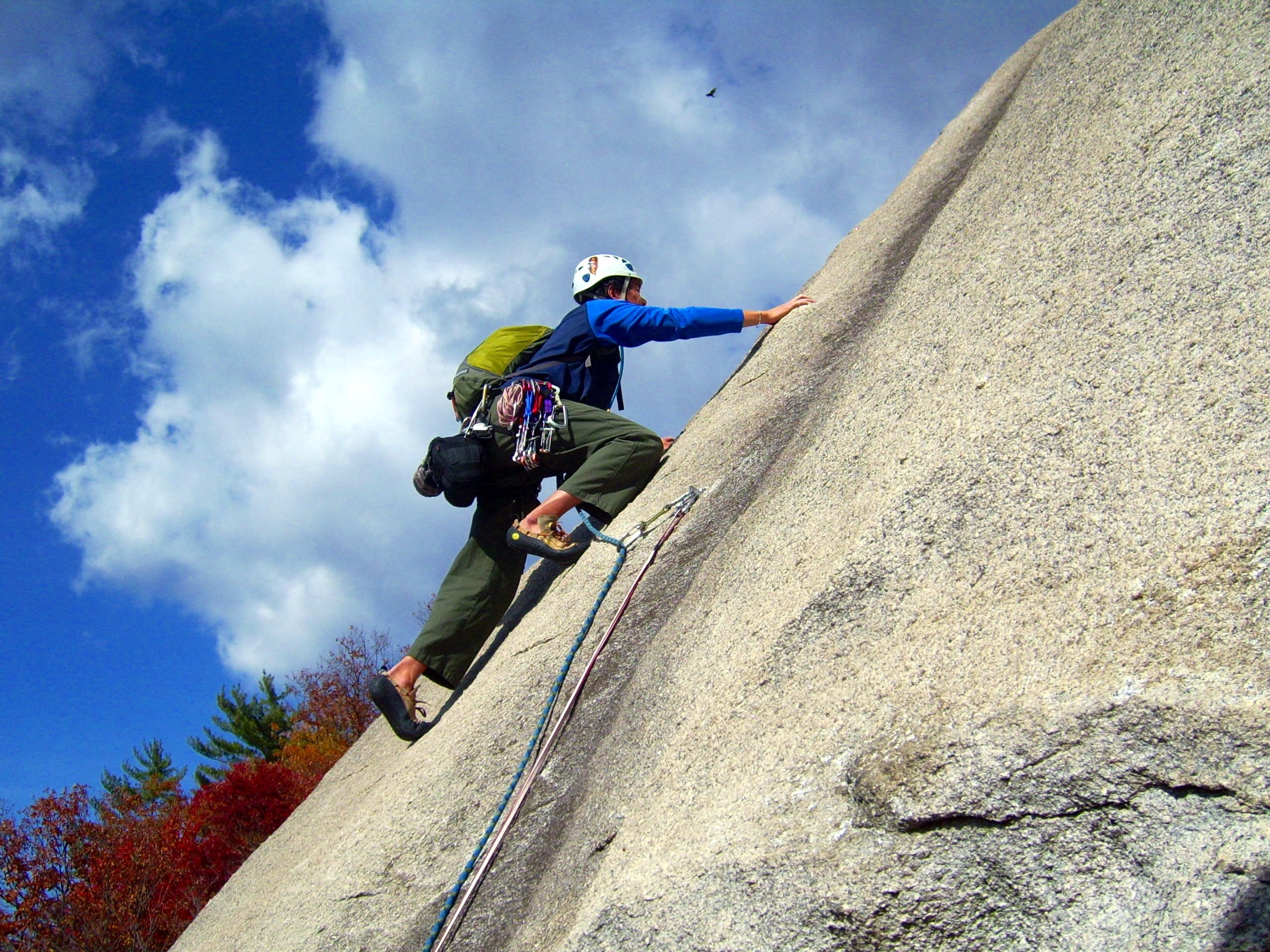 outdoor climber leading a pitch