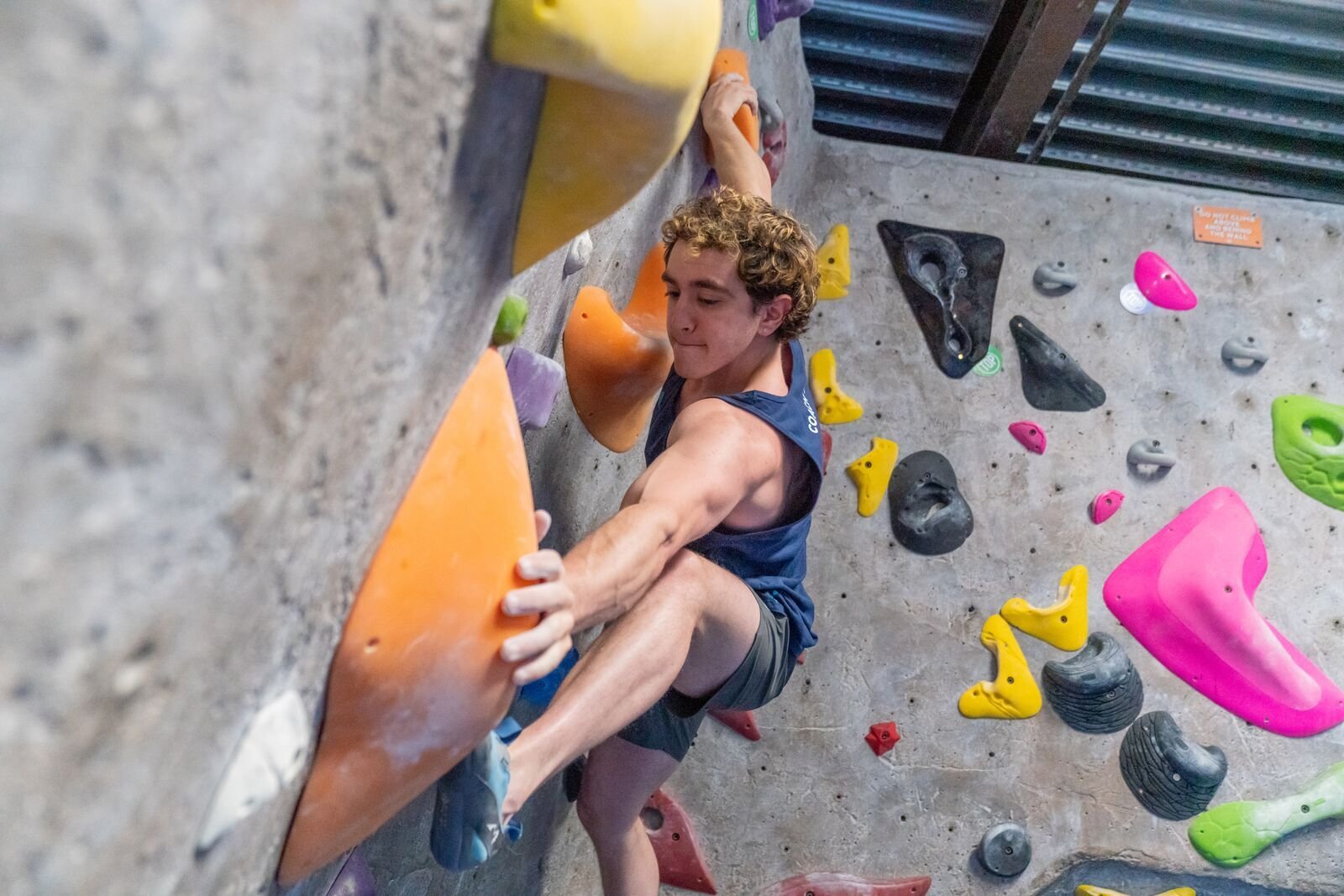 Climber placing a foot on a hold