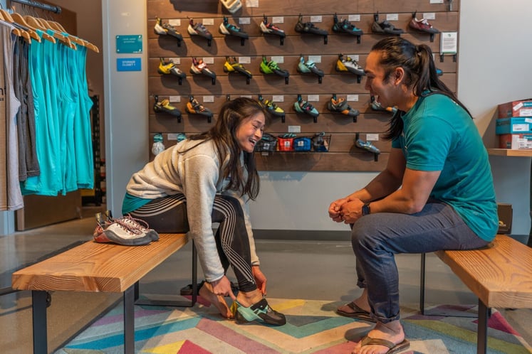 Climber trying on a pair of shoes