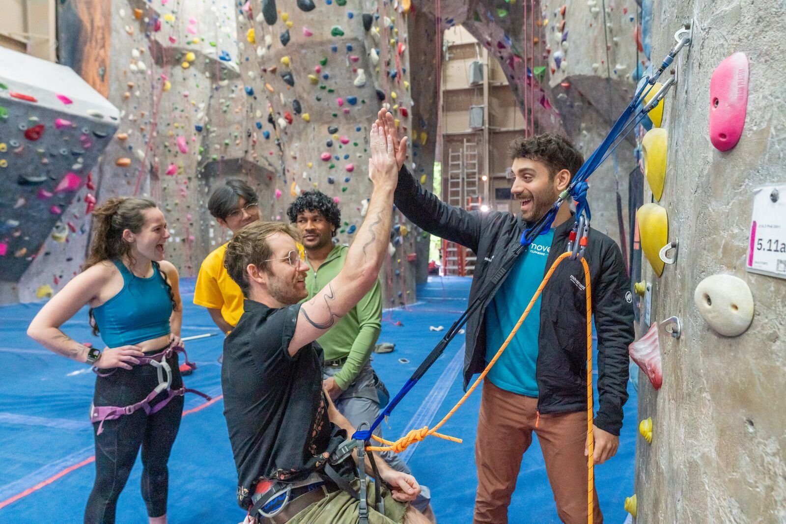 Climbers and Instructor practicing cleaning anchors