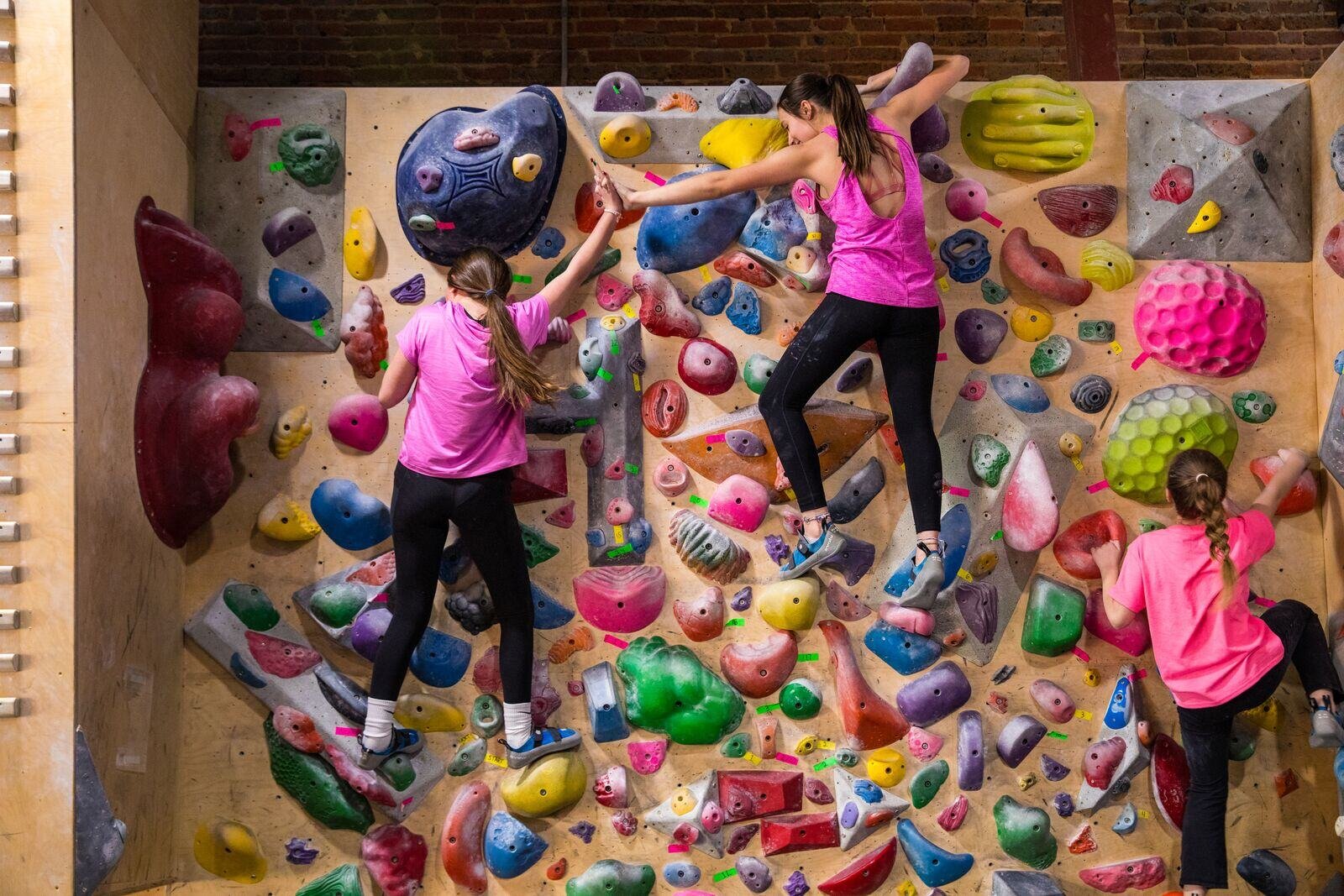 youth climbers celebrating each other