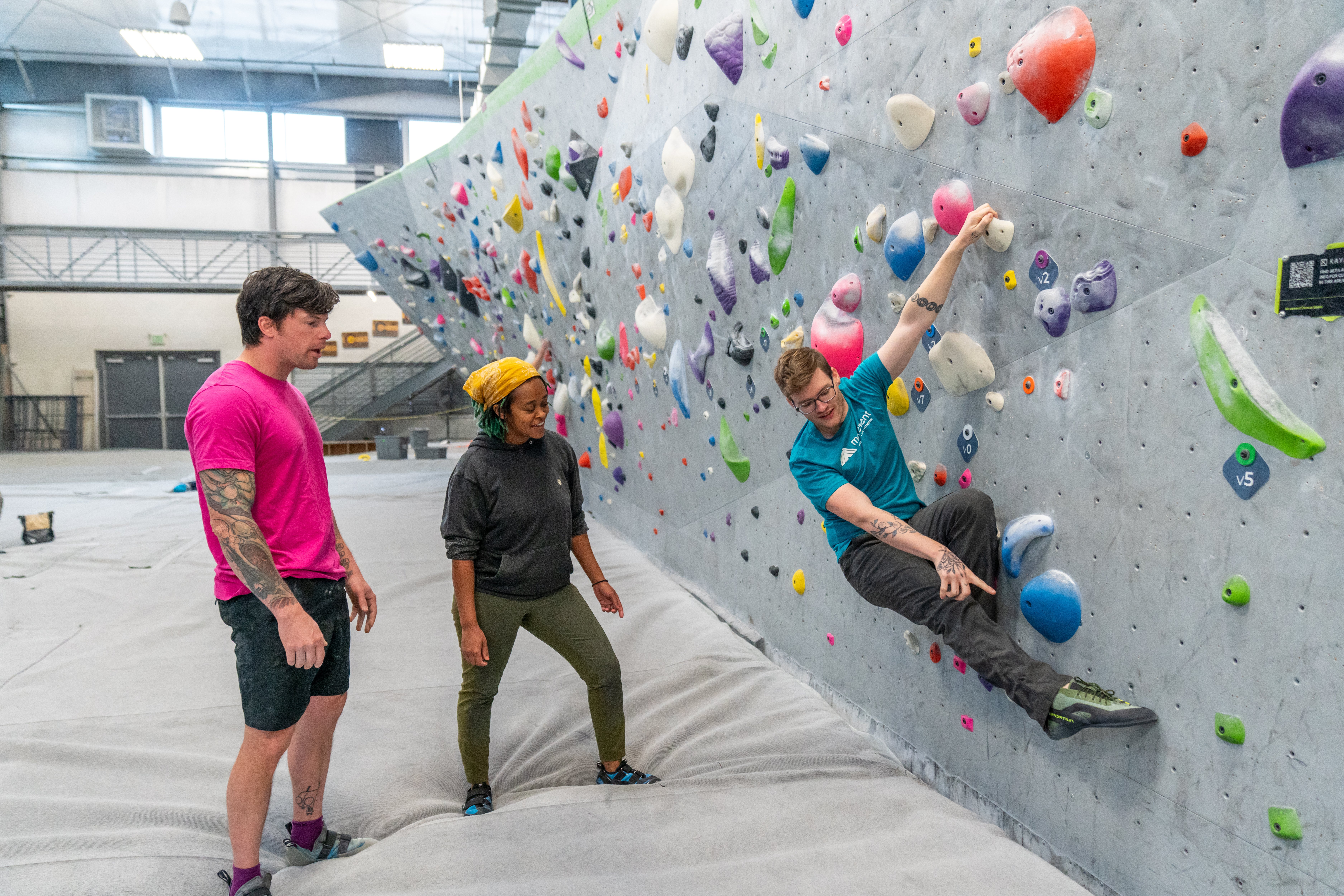 Climbing instructor demonstrating what a flag looks like
