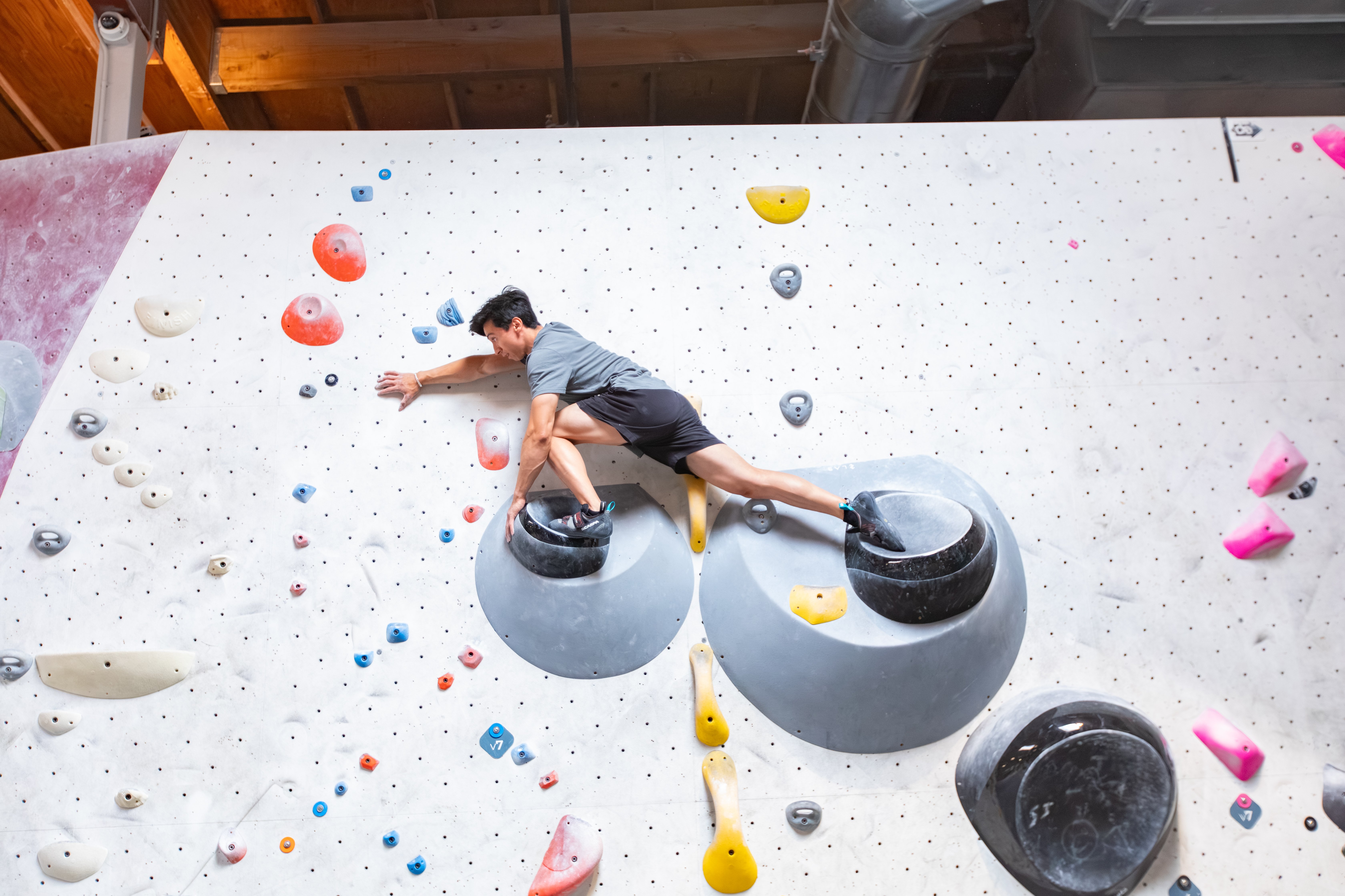 Climber setting up to use the rock over technique while climbing